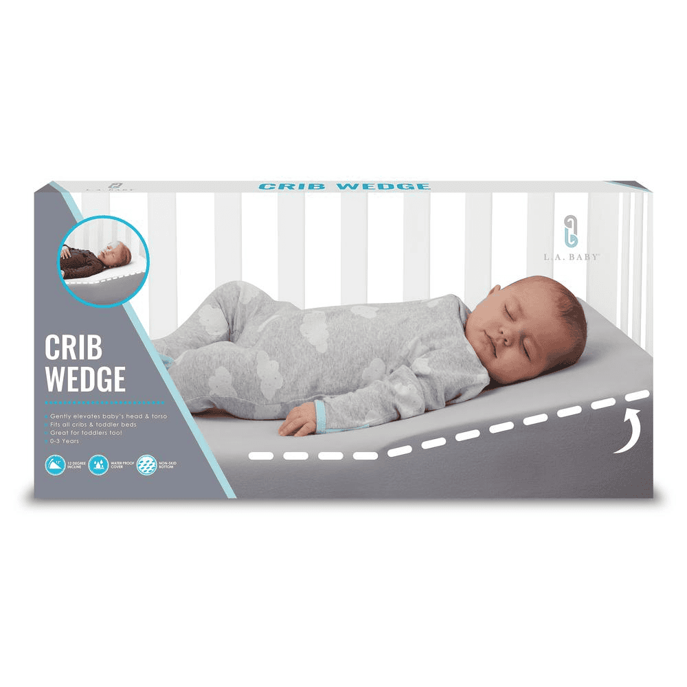 Skråpude til tremmeseng fra LA Baby, hjælper med at reducere refluks hos spædbørn. Grå pude med sovende baby, ergonomisk designet til komfort.