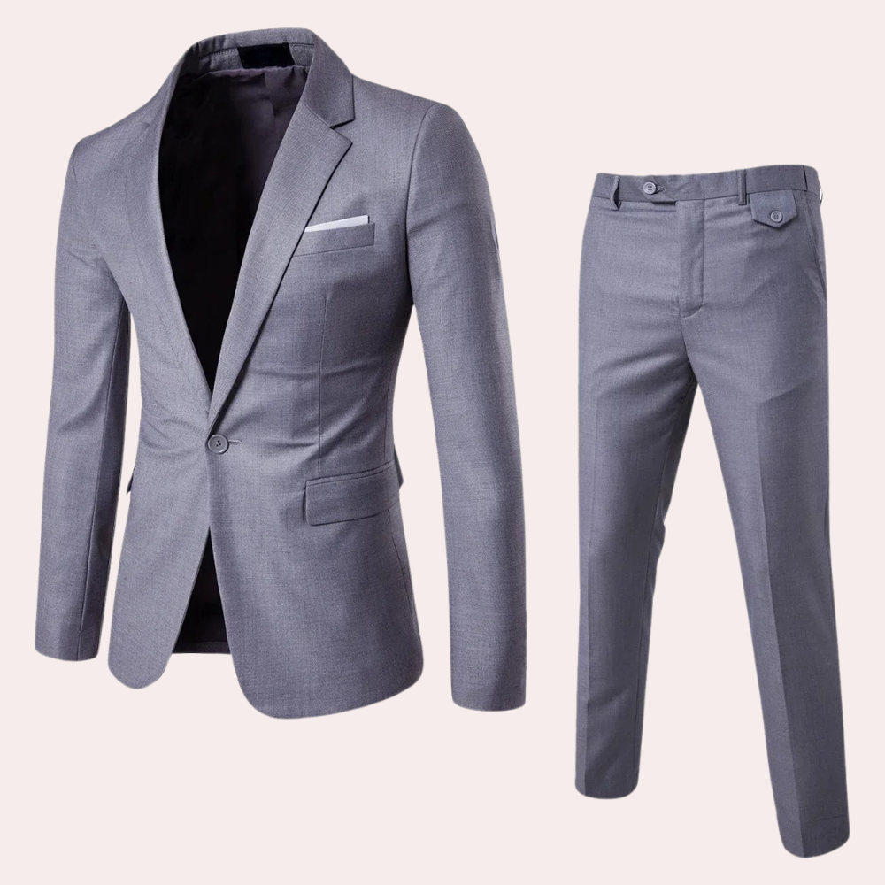 Gråt jakkesæt til mænd, bestående af en elegant blazer og matchende bukser. Perfekt til formelle begivenheder og kontorbrug.
