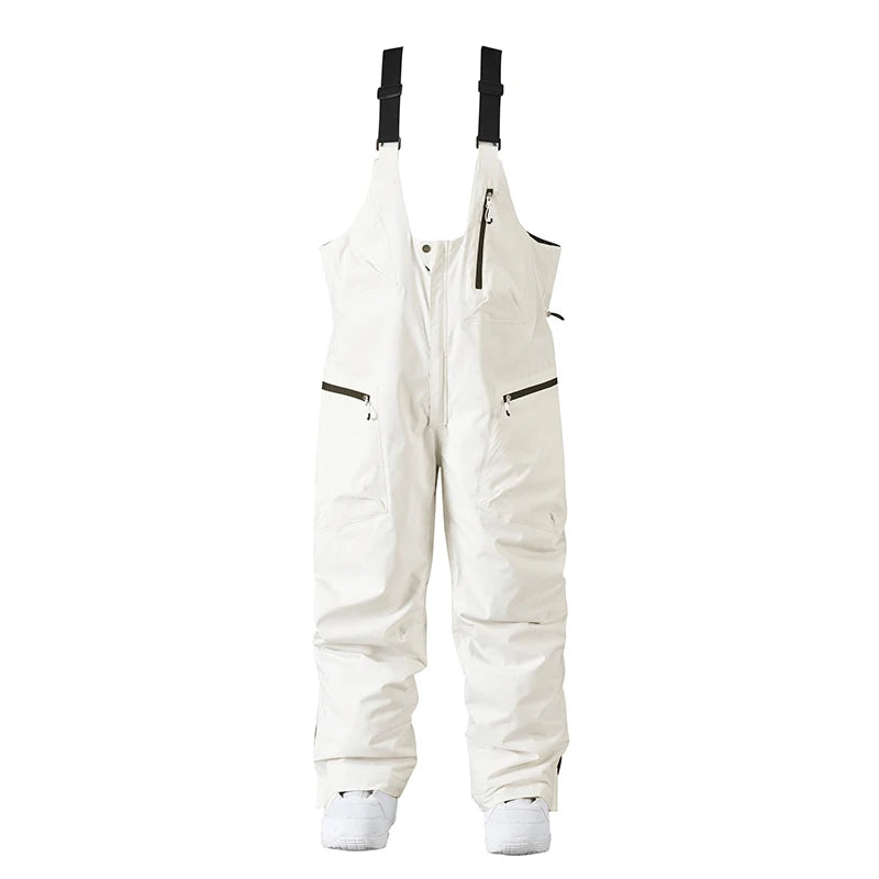 Hvide skibukser med seler, vandtætte og isolerede, designet til vinteraktiviteter. Perfekte til skiløb og snowboarding. Unisex pasform.