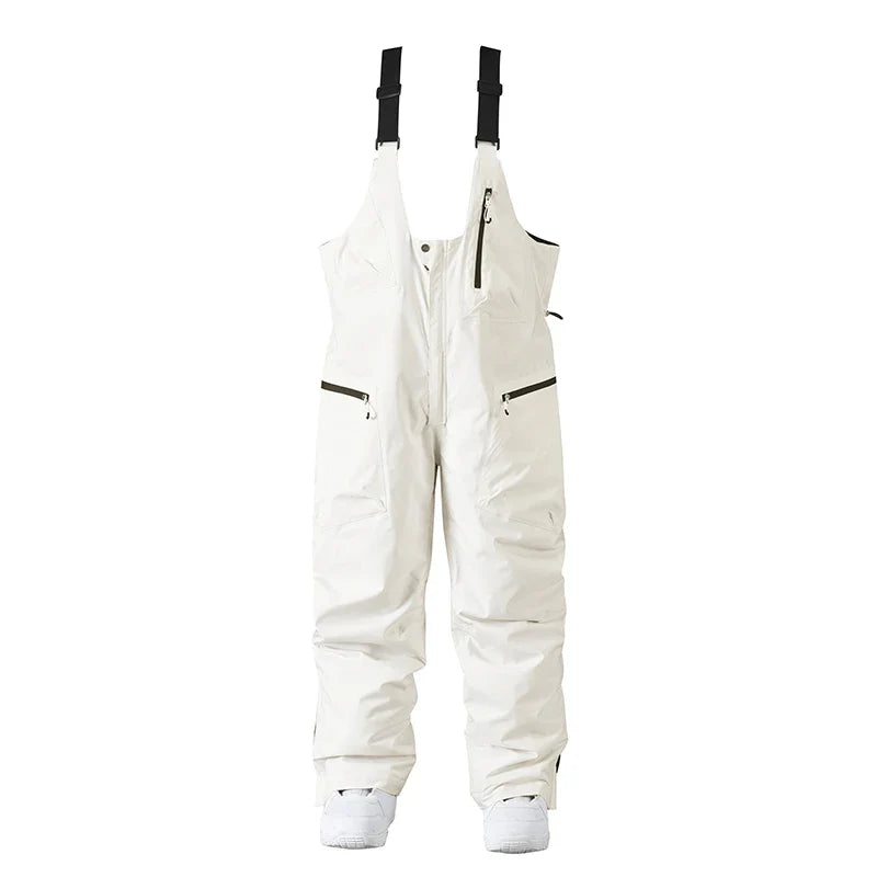 Hvide skibukser med seler, vandtætte og isolerede, designet til vinteraktiviteter. Perfekte til skiløb og snowboarding. Unisex pasform.