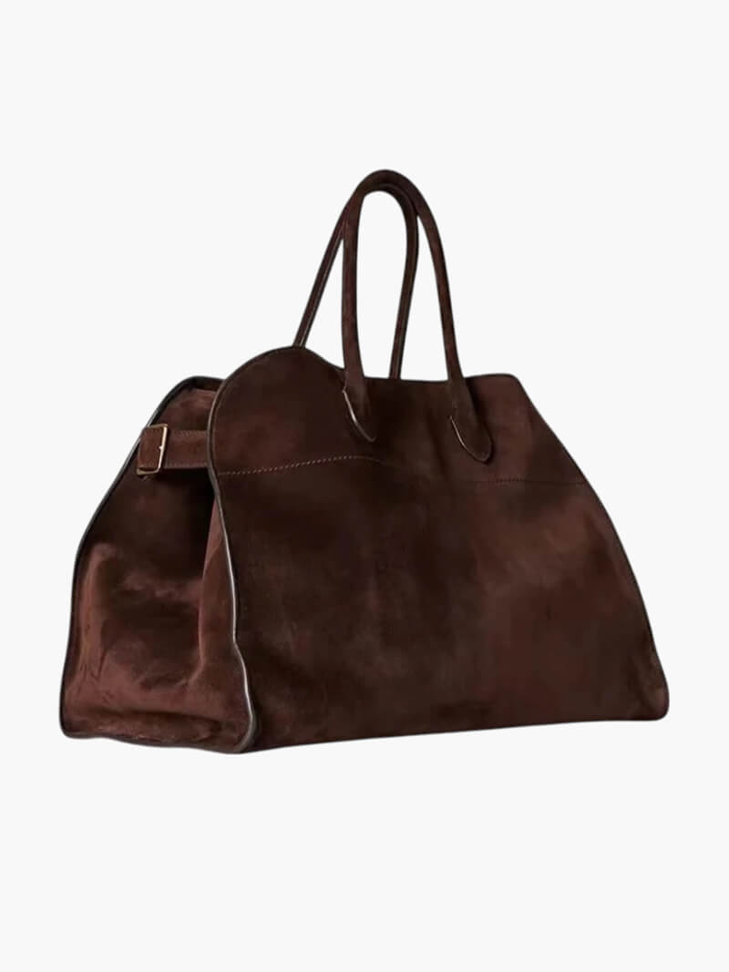 Brun ruskindstaske med håndtag, elegant design, rummelig indvendig plads, perfekt til modebevidste kvinder. Ideel til daglig brug og rejser.