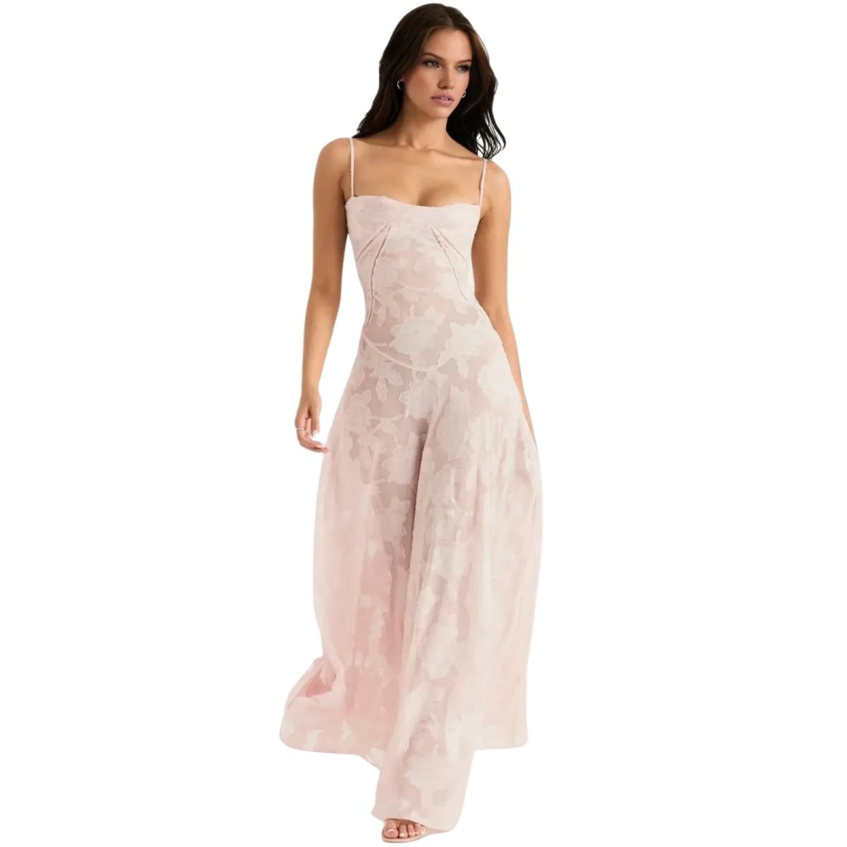 Woman wearing a light pink Kouvr strapless jumpsuit on a white background