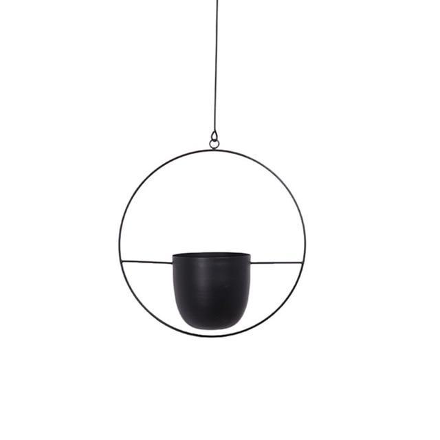 Sort hængeplanteholder i metal med cirkulært design, minimalistisk stil. Perfekt til indendørs dekoration og moderne boligindretning.