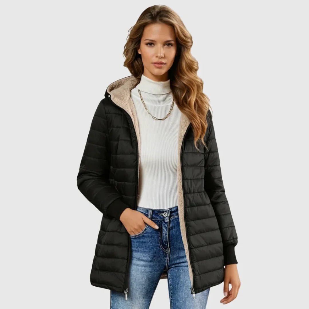 Black women's puffer trench coat with sherpa lining, hood, and ribbed cuffs.