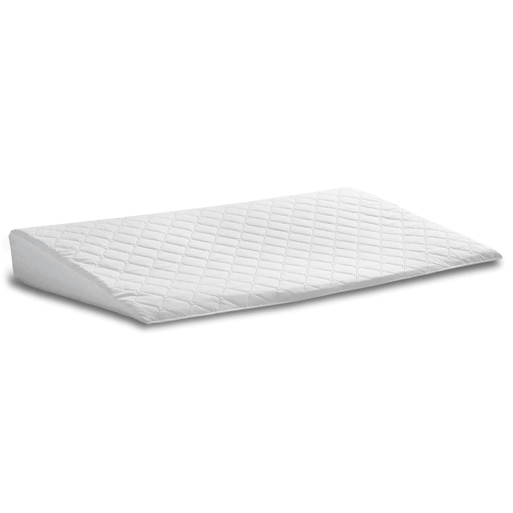 Hvid kilepude med quiltet betræk, ergonomisk designet til rygstøtte og komfort. Ideel til søvn og afslapning. Perfekt til soveværelset.