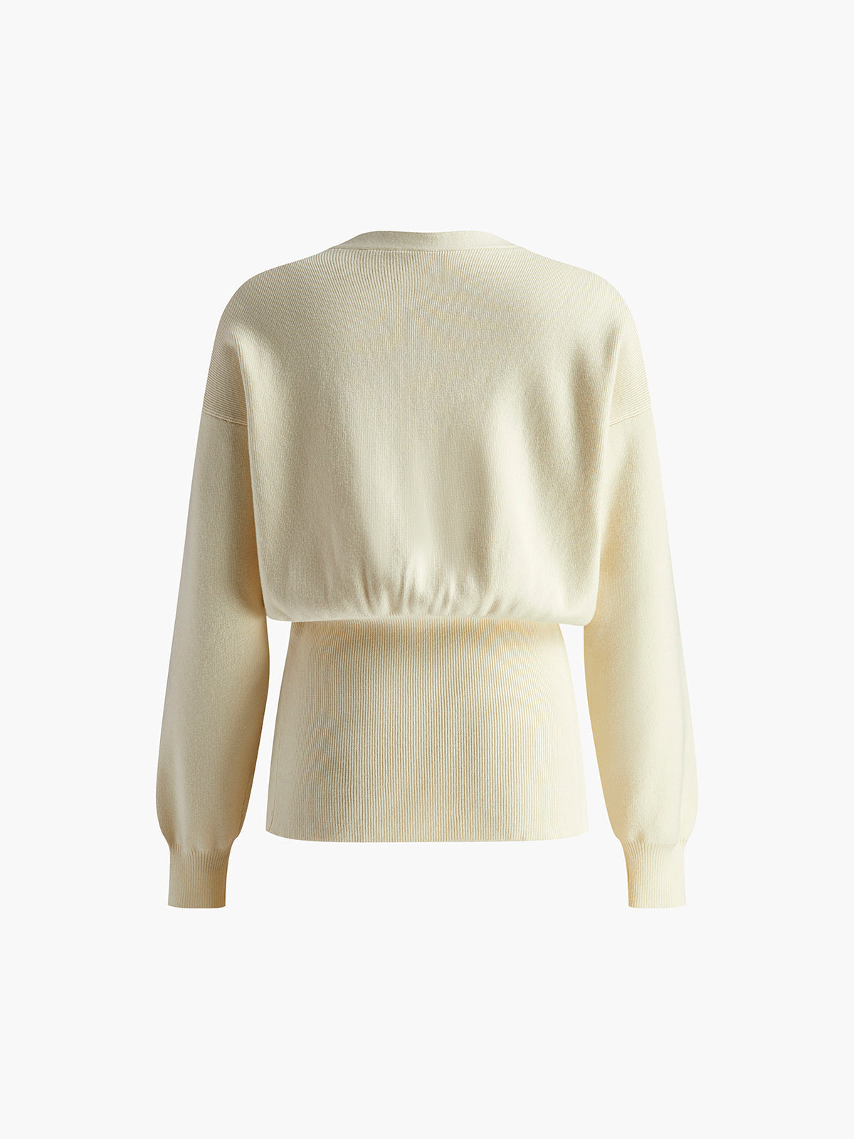 Beige striktrøje til kvinder, set bagfra, med lange ærmer og elastisk talje. Stilfuldt og komfortabelt design til efterår og vinter.