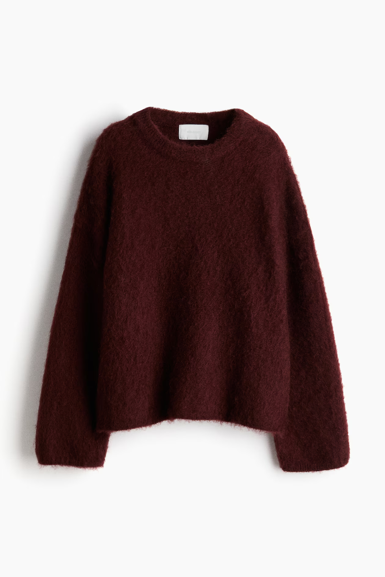 Bordeauxrød uldtrøje til kvinder, langærmet og blød tekstur. Perfekt til efterår og vintermode. Stilfuld og varm sweater til hverdagsbrug.
