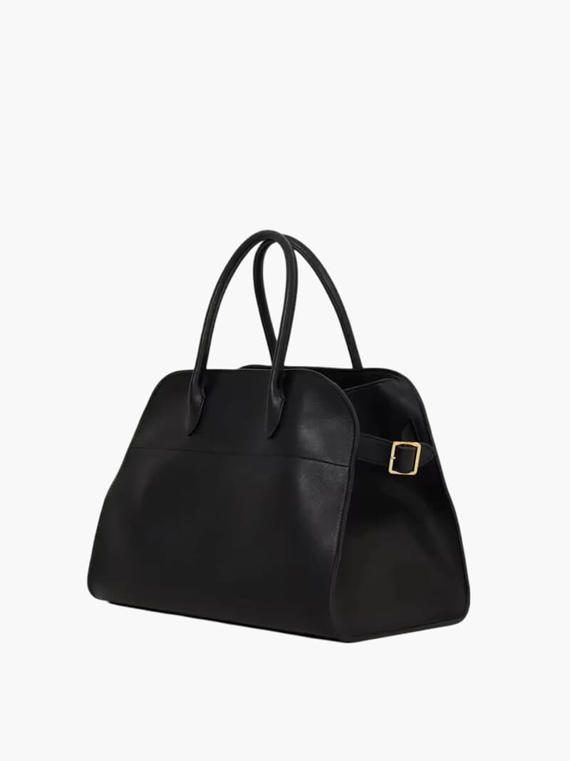 Sort læderhåndtaske med guldspænde, elegant design, dobbelte håndtag, perfekt til modebevidste kvinder. Ideel til hverdagsbrug og rejser.