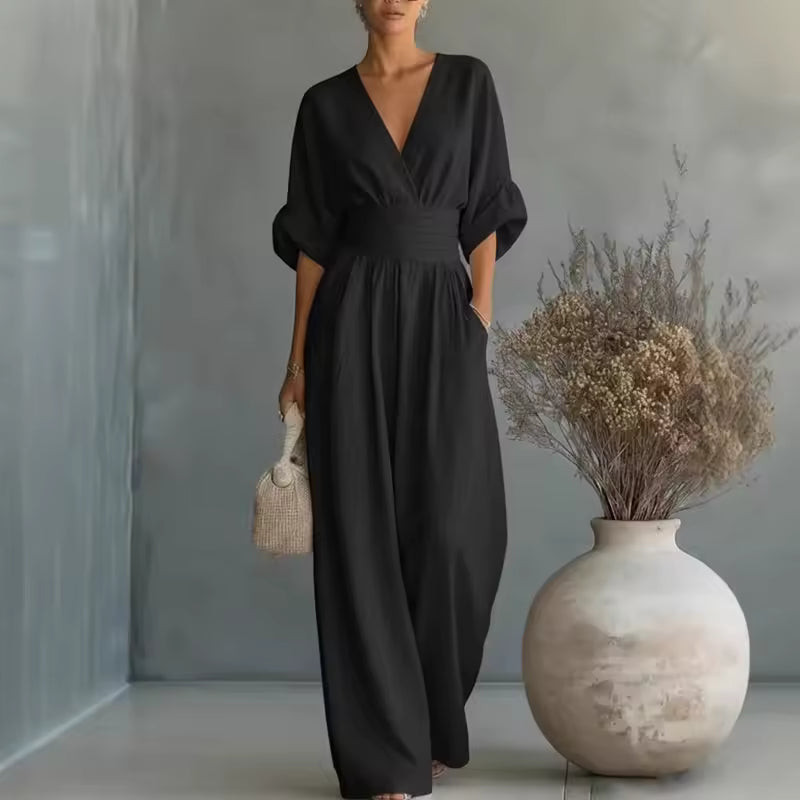 Elegant jumpsuit med dyb V-udskæring og brede ben