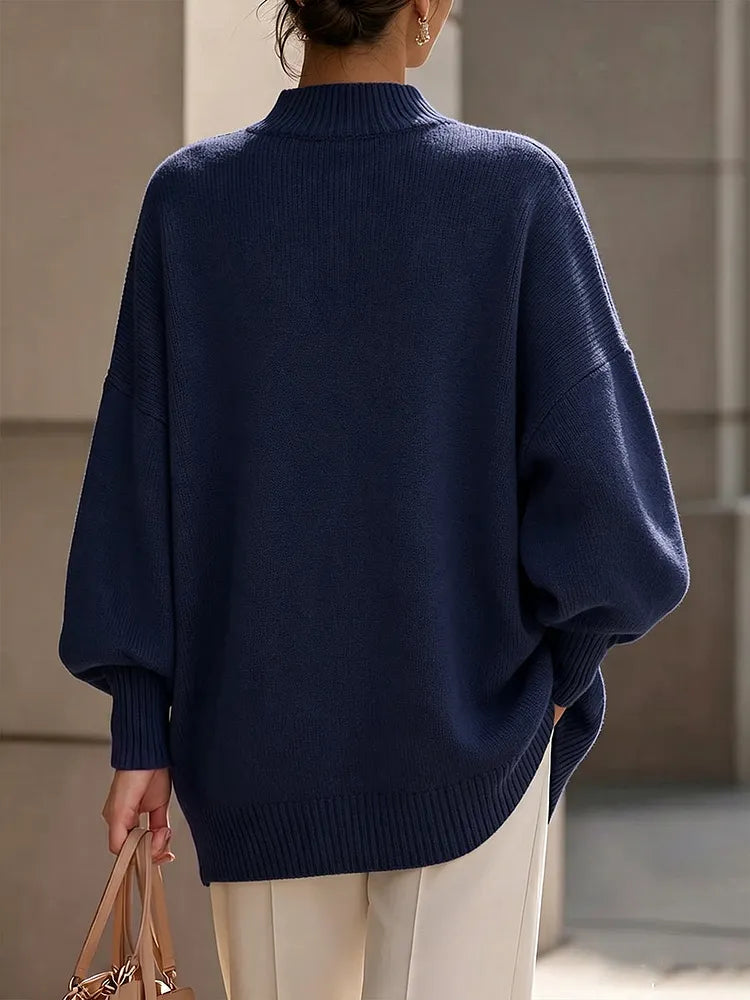 Élégant pull asymétrique en maille avec boutons dorés