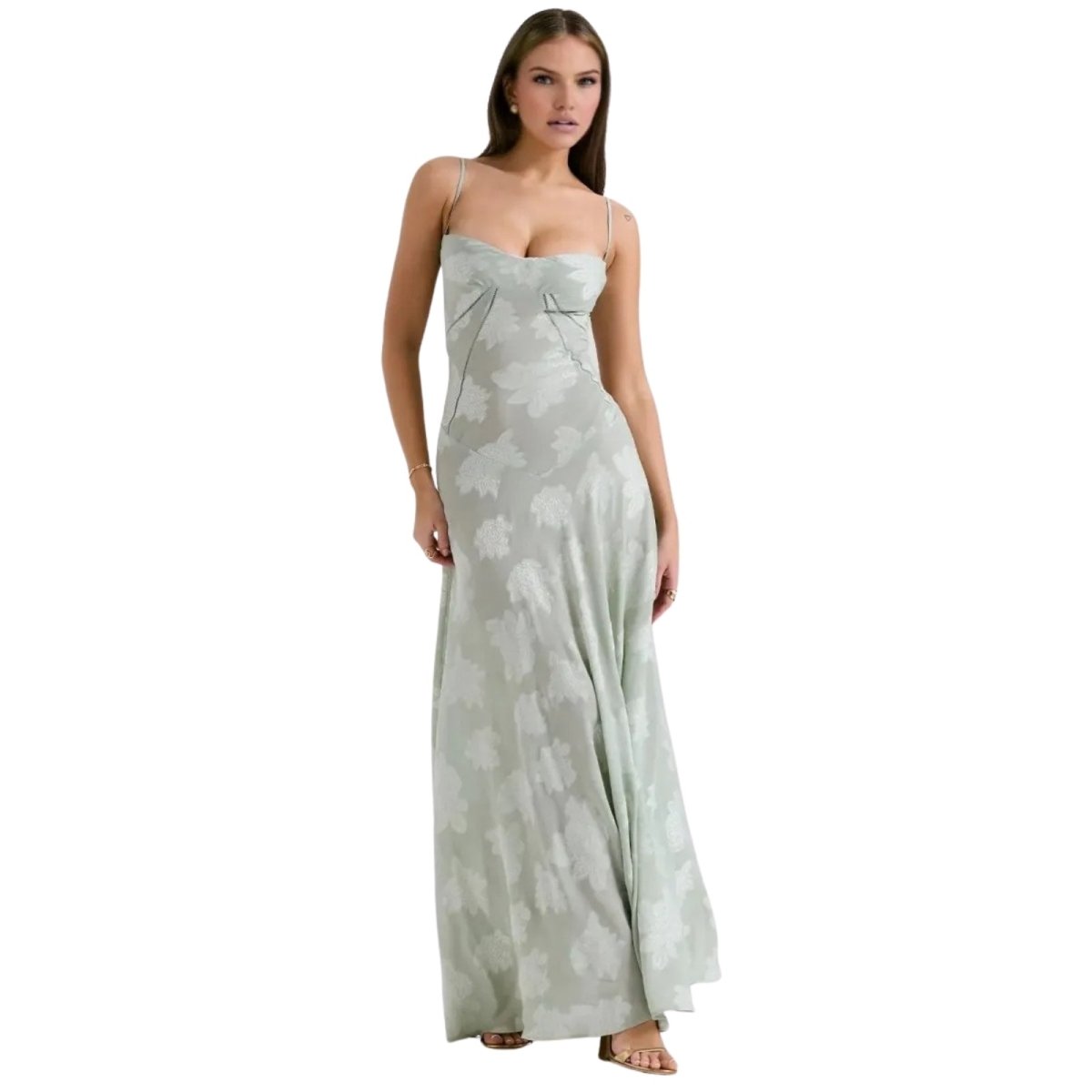 Woman wearing a strapless, long, light-colored Kouvr dress on a white background