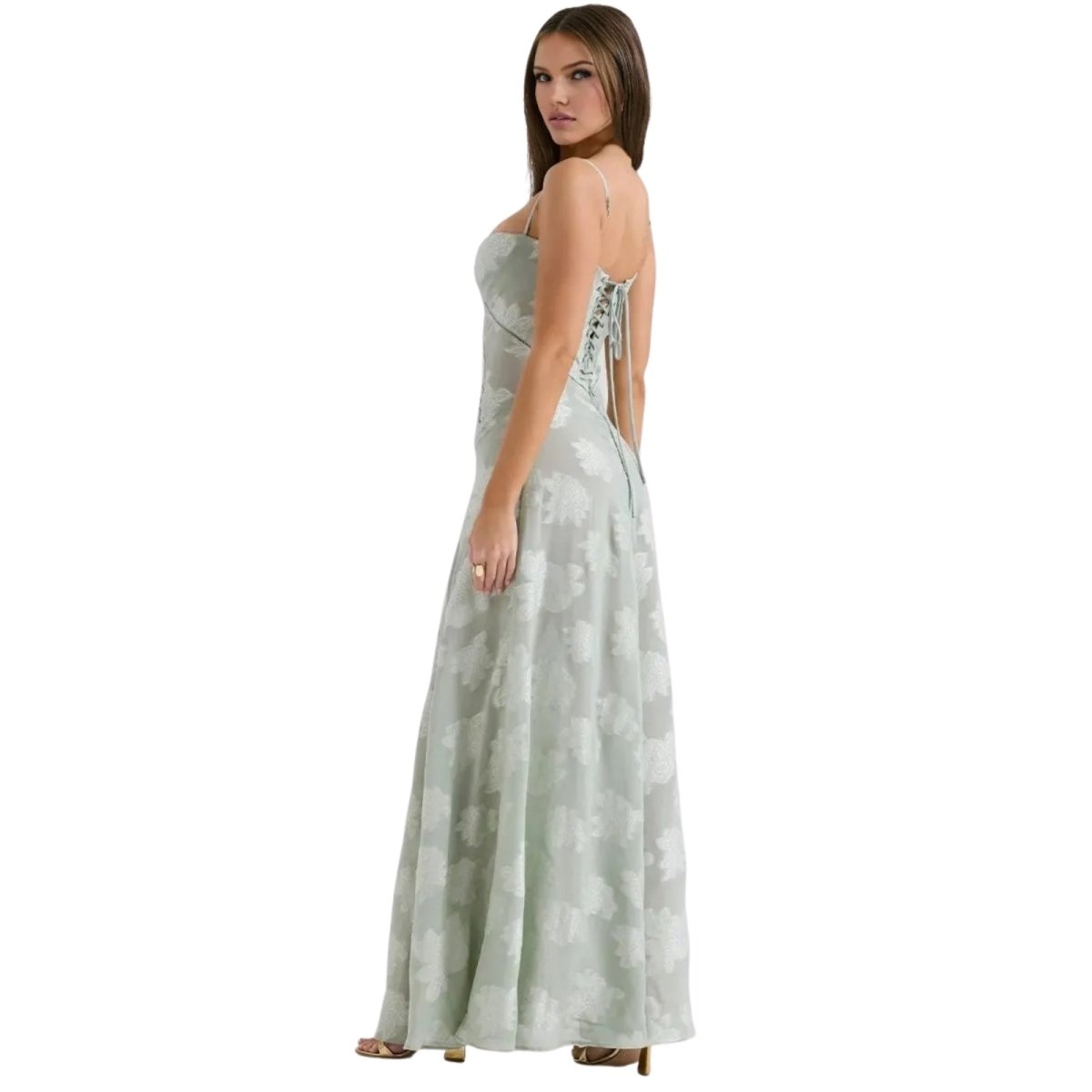 Woman wearing a strapless, floor-length Kouvr dress with a subtle pattern on a white background