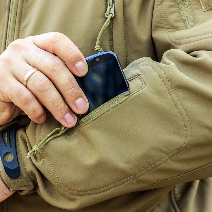 Waterproof women's set: hooded jacket, cargo pants with multiple side pockets.